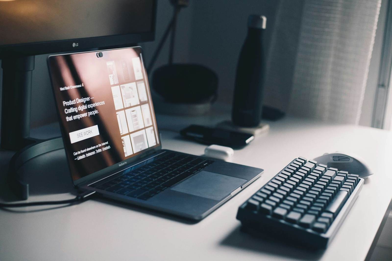 Laptop and keyboard on a desk