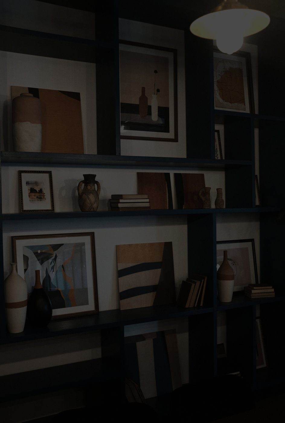 Styled shelves with art and ceramics