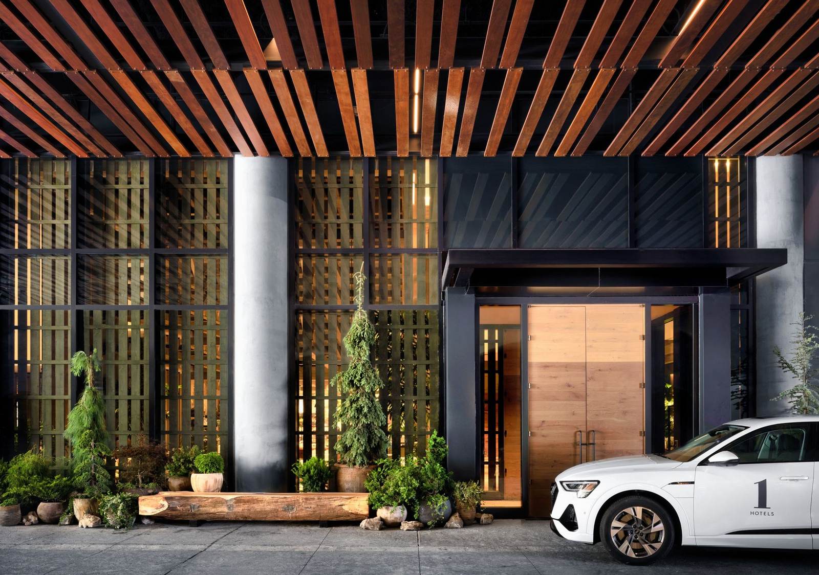 Hotel entrance with a slatted wood canopy