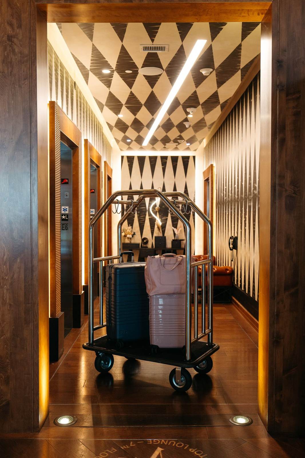Bell cart in a wood-paneled hallway